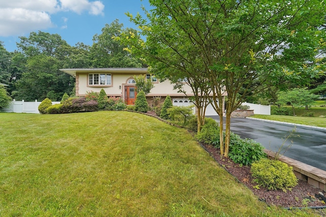 30 Birchwood Ter, Nanuet, NY 10954 - bi-level home featuring driveway, a garage, and stucco siding