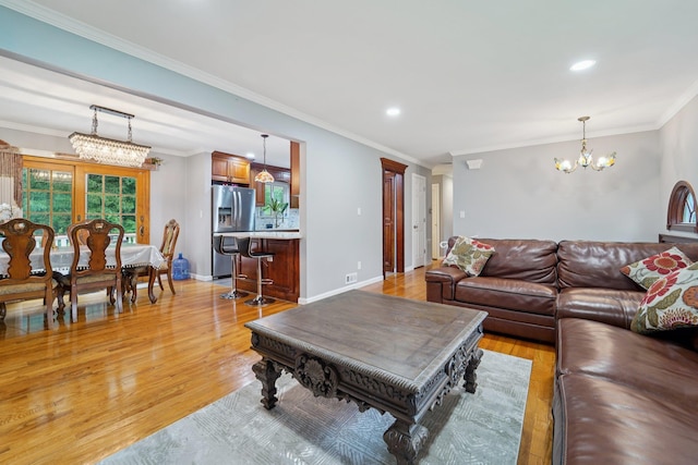 30 Birchwood Ter, Nanuet, NY 10954 - living room with a chandelier, light wood-style floors, crown molding, and recessed lighting