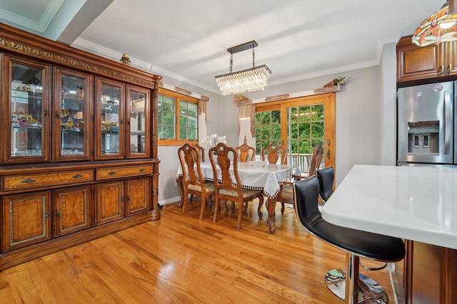 30 Birchwood Ter, Nanuet, NY 10954 - dining room featuring a chandelier, ornamental molding, light wood-style floors, and healthy amount of natural light