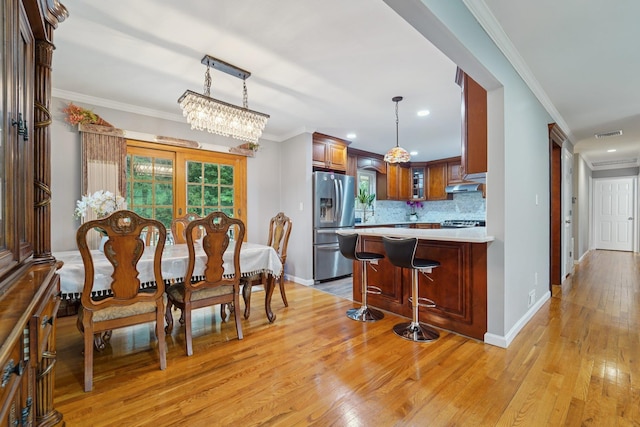 30 Birchwood Ter, Nanuet, NY 10954 - dining area featuring light wood finished floors, recessed lighting, and ornamental molding