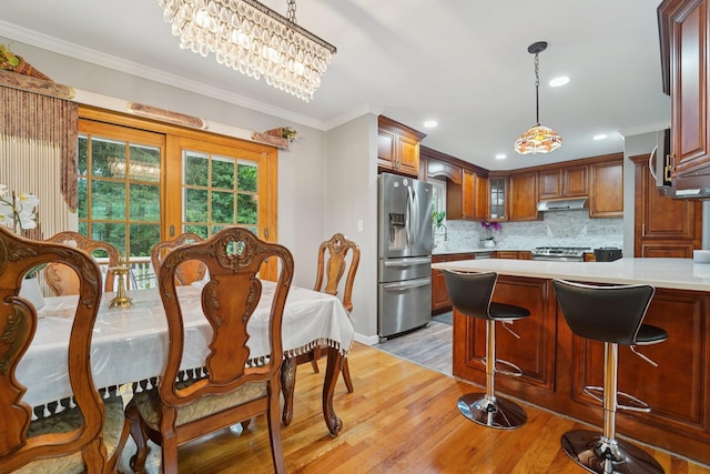 30 Birchwood Ter, Nanuet, NY 10954 - dining space with light wood finished floors, crown molding, and recessed lighting