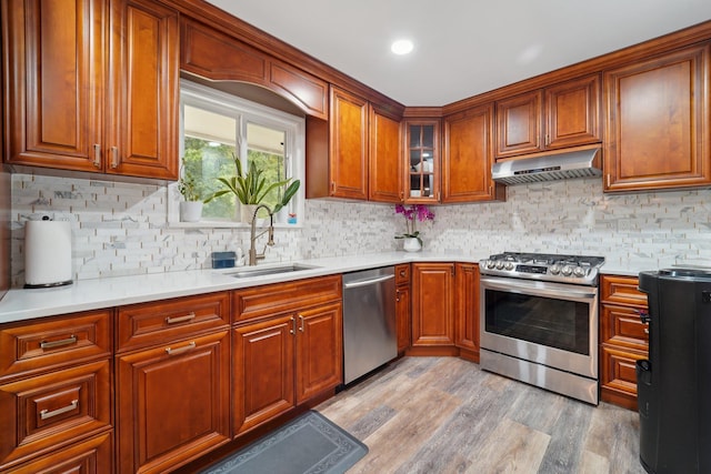 30 Birchwood Ter, Nanuet, NY 10954 - kitchen with appliances with stainless steel finishes, under cabinet range hood, and brown cabinets