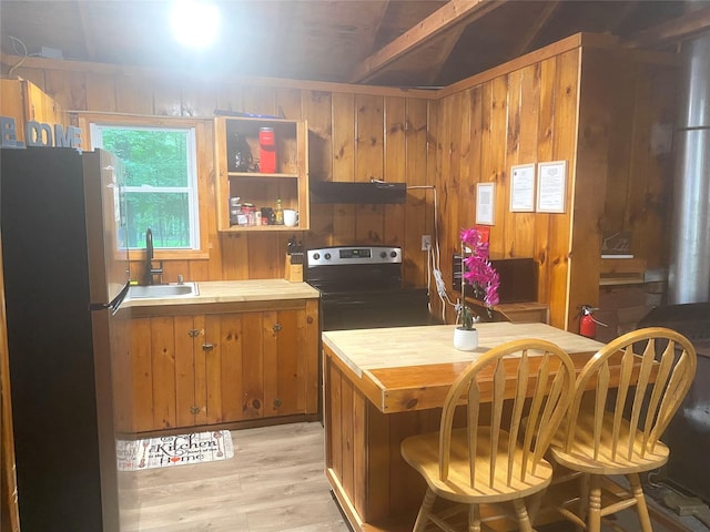 55 Woodcrest Dr, Middletown, NY 10940 - kitchen featuring stainless steel appliances, wooden counters, light wood-type flooring, brown cabinetry, and ventilation hood