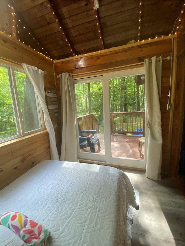 55 Woodcrest Dr, Middletown, NY 10940 - bedroom with wooden ceiling, multiple windows, vaulted ceiling, wood walls, and access to outside