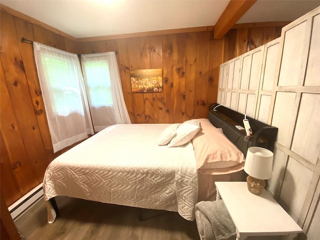 55 Woodcrest Dr, Middletown, NY 10940 - bedroom with wood finished floors, wood walls, beamed ceiling, and a baseboard radiator