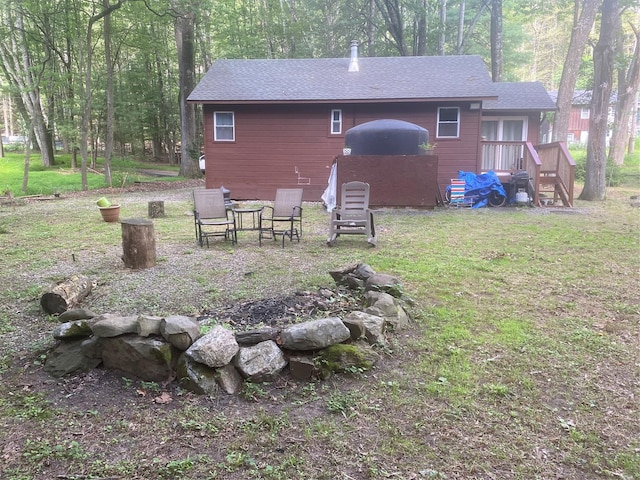 55 Woodcrest Dr, Middletown, NY 10940 - back of house featuring roof with shingles and a lawn