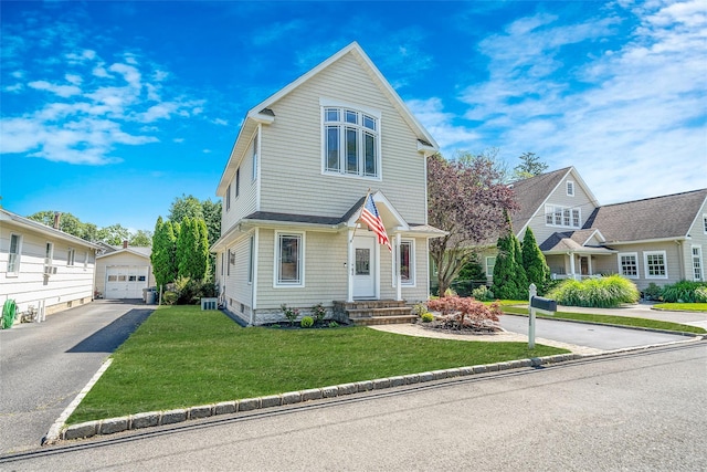 1025 Harrison Dr, Centerport, NY 11721 - view of front of house featuring an outdoor structure, driveway, a detached garage, and a front yard