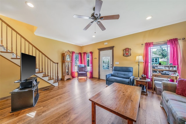 1025 Harrison Dr, Centerport, NY 11721 - living area featuring stairway, ceiling fan, ornamental molding, light wood finished floors, and recessed lighting