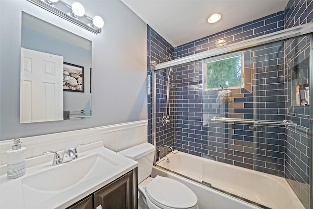 1025 Harrison Dr, Centerport, NY 11721 - bathroom with vanity, combined bath / shower with glass door, a wainscoted wall, and recessed lighting