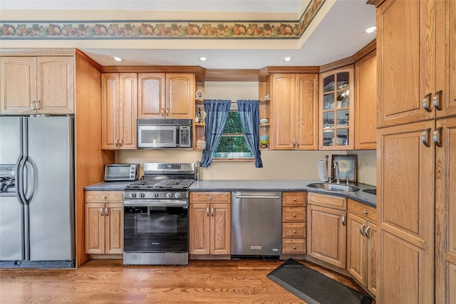 1025 Harrison Dr, Centerport, NY 11721 - kitchen featuring stainless steel appliances, dark countertops, recessed lighting, wood finished floors, and open shelves
