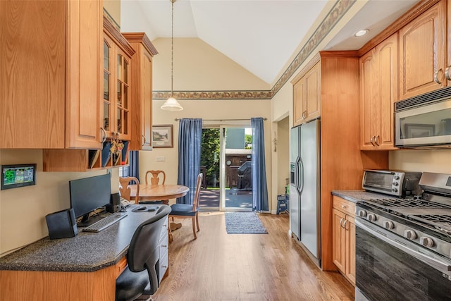 1025 Harrison Dr, Centerport, NY 11721 - kitchen featuring stainless steel appliances, vaulted ceiling, light wood finished floors, glass insert cabinets, and pendant lighting