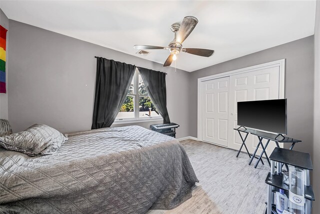 1025 Harrison Dr, Centerport, NY 11721 - bedroom with wood finished floors, a closet, and a ceiling fan
