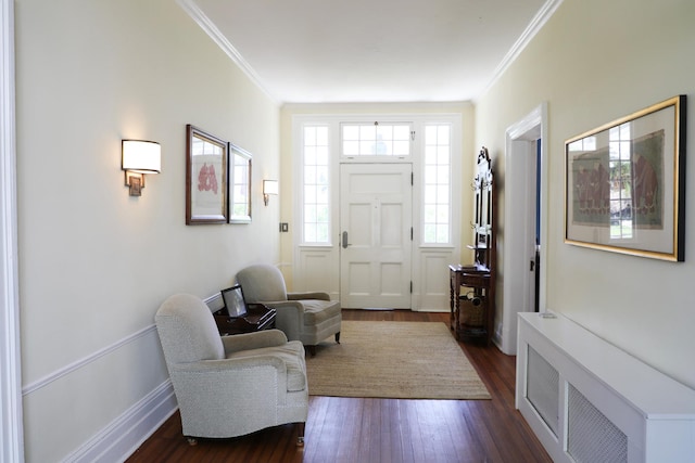 15 Abbey Crk, East Islip, NY 11730 - entrance foyer with radiator, ornamental molding, and dark wood-style flooring