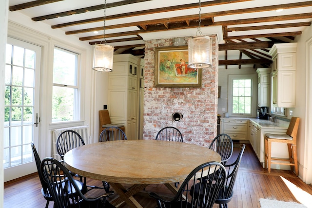 15 Abbey Crk, East Islip, NY 11730 - dining room featuring dark wood-style flooring and beamed ceiling