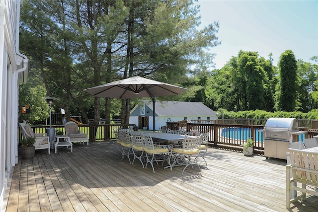 15 Abbey Crk, East Islip, NY 11730 - deck with area for grilling, outdoor dining area, and view of wooded area