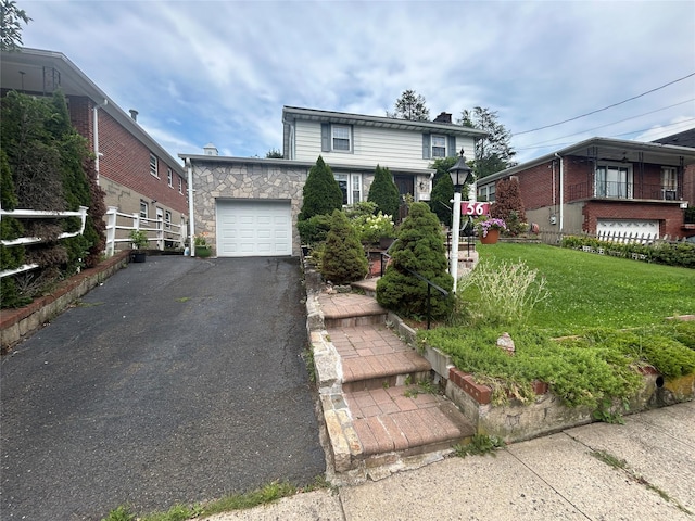 56 Helena Ave, Yonkers, NY 10710 - traditional home with an attached garage, driveway, a chimney, and stone siding