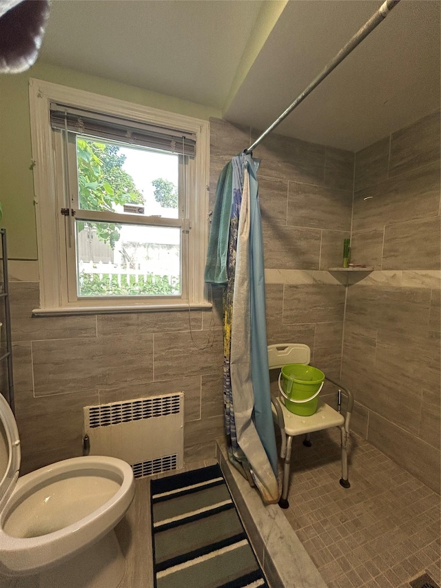 56 Helena Ave, Yonkers, NY 10710 - full bathroom featuring radiator heating unit, tile walls, and tiled shower