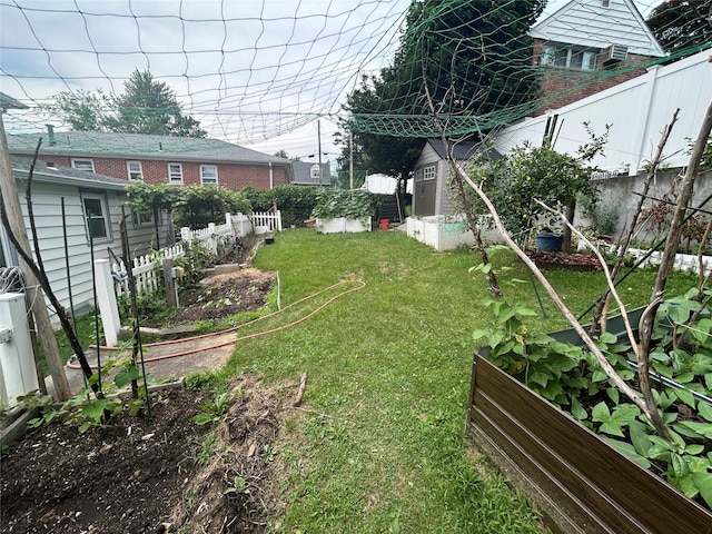 56 Helena Ave, Yonkers, NY 10710 - view of yard featuring a vegetable garden and a storage shed