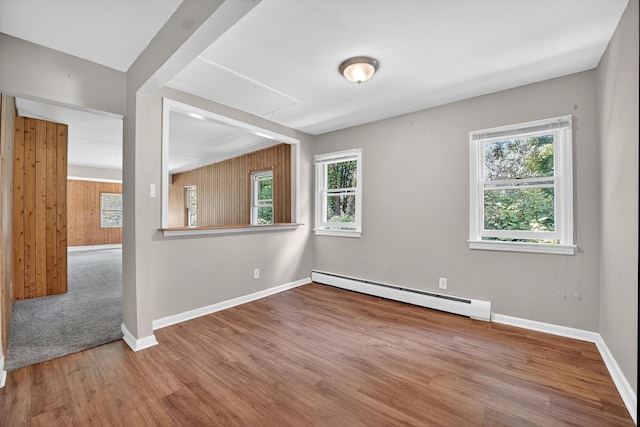 11 Tribune Ln, Red Hook, NY 12571 - empty room featuring baseboard heating, wood finished floors, and attic access