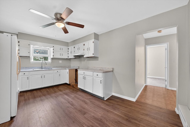 11 Tribune Ln, Red Hook, NY 12571 - kitchen with freestanding refrigerator, light countertops, dark wood-style floors, and a ceiling fan