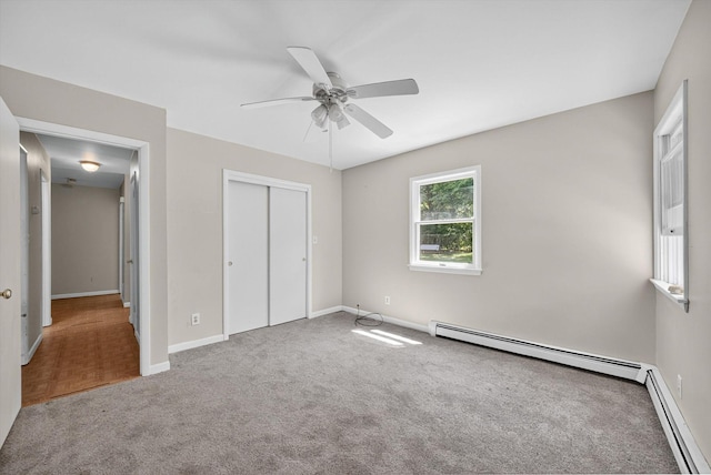 11 Tribune Ln, Red Hook, NY 12571 - unfurnished bedroom with a baseboard radiator, carpet floors, a closet, and ceiling fan