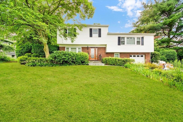 50 Chester Dr, Yonkers, NY 10710 - tri-level home with a garage, brick siding, and a front lawn