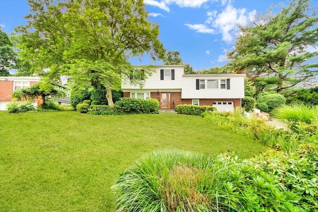 50 Chester Dr, Yonkers, NY 10710 - view of front of house featuring brick siding, a garage, and a front lawn