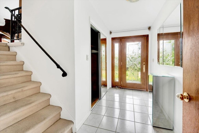 50 Chester Dr, Yonkers, NY 10710 - foyer with stairway and light tile patterned floors