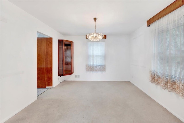 50 Chester Dr, Yonkers, NY 10710 - carpeted empty room with a chandelier and baseboards