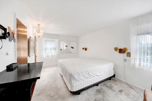 50 Chester Dr, Yonkers, NY 10710 - bedroom with multiple windows, carpet, and a chandelier