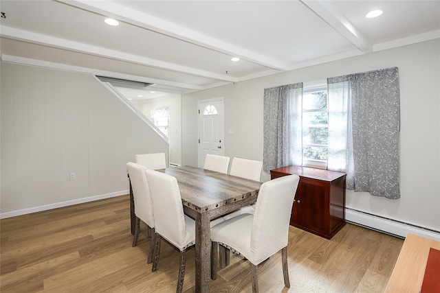 16 Primrose Ln, Levittown, NY 11756 - dining area featuring baseboard heating, beam ceiling, light wood-style floors, stairs, and recessed lighting