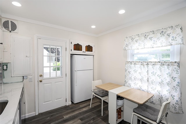 16 Primrose Ln, Levittown, NY 11756 - dining room featuring dark wood-style flooring, recessed lighting, electric panel, and ornamental molding