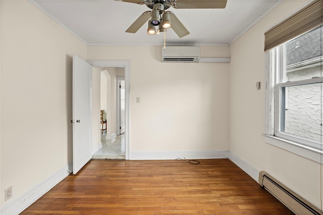 178 Charles St, Lynbrook, NY 11563 - empty room featuring a baseboard heating unit, a wall mounted air conditioner, crown molding, a ceiling fan, and wood finished floors