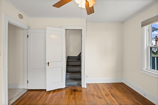 178 Charles St, Lynbrook, NY 11563 - unfurnished bedroom with hardwood / wood-style floors, crown molding, and ceiling fan