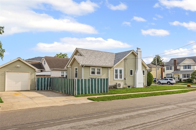 178 Charles St, Lynbrook, NY 11563 - view of front of property featuring a chimney, concrete driveway, a shingled roof, and a residential view