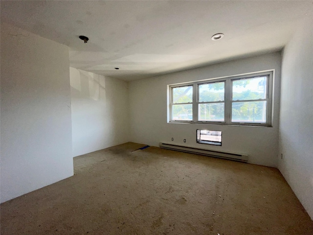 100 Connetquot Ave Unit 10, East Islip, NY 11730 - carpeted spare room featuring baseboard heating