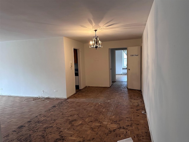 210-15 23rd Ave Unit 1J, Bayside, NY 11360 - spare room with a chandelier and baseboards