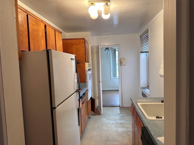 210-15 23rd Ave Unit 1J, Bayside, NY 11360 - kitchen featuring white appliances, brown cabinetry, light colored carpet, and a warming drawer