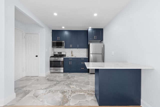 37-56 87th St Unit 3C, Jackson Heights, NY 11372 - kitchen with stainless steel appliances, blue cabinets, decorative backsplash, a peninsula, and recessed lighting