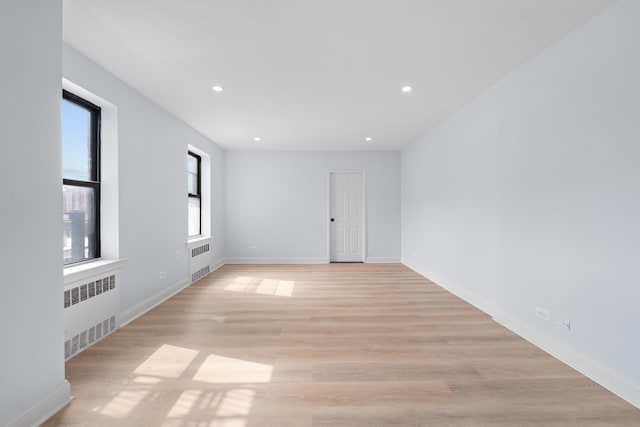 37-56 87th St Unit 3C, Jackson Heights, NY 11372 - spare room featuring radiator, recessed lighting, and light wood finished floors