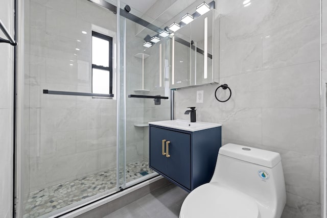 37-56 87th St Unit 3C, Jackson Heights, NY 11372 - bathroom with a shower stall, vanity, and tile walls