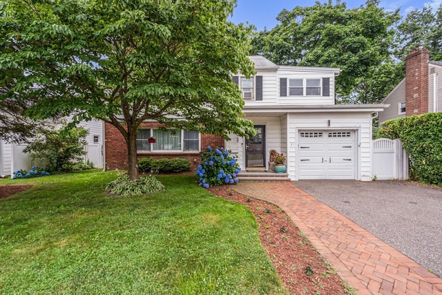21 Orchard St, Glen Head, NY 11545 - view of front of home featuring asphalt driveway, brick siding, and a garage