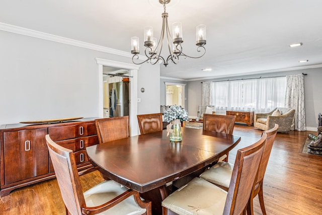 21 Orchard St, Glen Head, NY 11545 - dining room featuring ornamental molding, a chandelier, wood finished floors, and recessed lighting