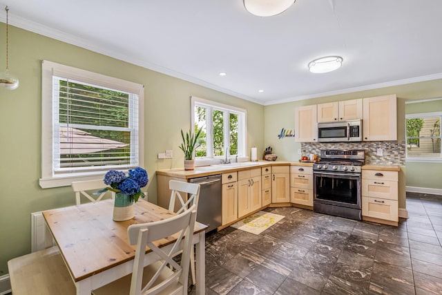 21 Orchard St, Glen Head, NY 11545 - kitchen featuring stainless steel appliances, light brown cabinetry, ornamental molding, light countertops, and decorative backsplash