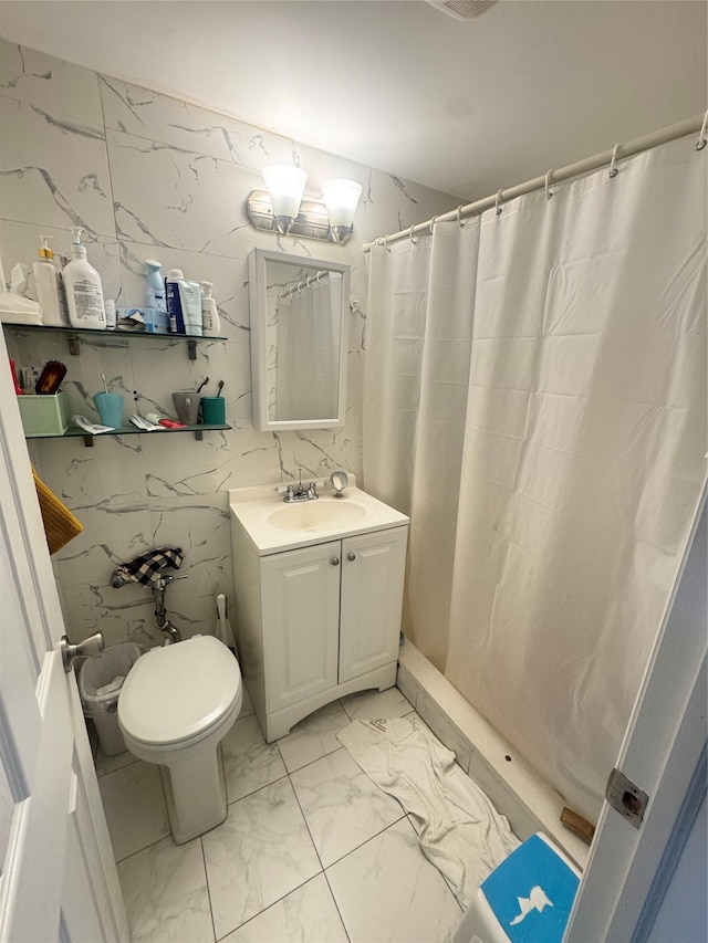 8114 Baxter Ave Unit 1E, Elmhurst, NY 11373 - full bathroom featuring marble look tiles, vanity, and curtained shower