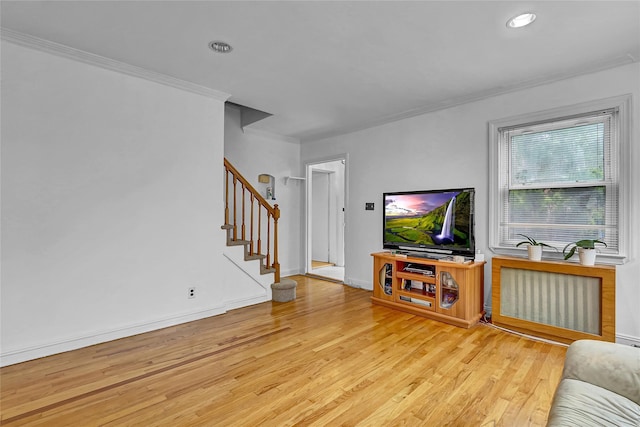 56-28 213th St, Bayside, NY 11364 - living area with radiator, ornamental molding, wood finished floors, stairway, and recessed lighting