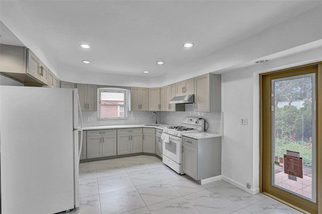 56-28 213th St, Bayside, NY 11364 - kitchen with white appliances, under cabinet range hood, gray cabinets, and recessed lighting