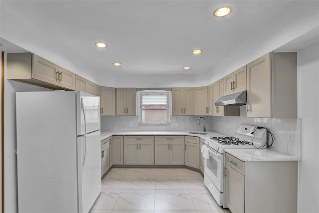56-28 213th St, Bayside, NY 11364 - kitchen with white appliances, under cabinet range hood, light marble finish floors, light countertops, and recessed lighting
