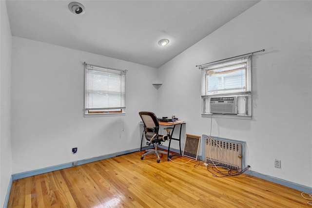 56-28 213th St, Bayside, NY 11364 - office space with cooling unit, plenty of natural light, vaulted ceiling, wood finished floors, and radiator