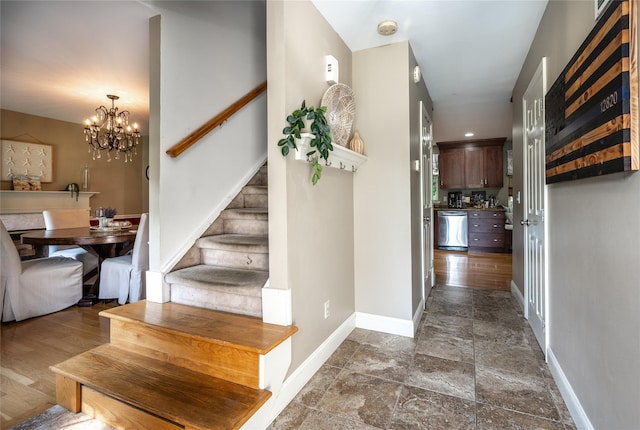 48 Devon Rd, Patterson, NY 12563 - stairway with stone tile flooring and a chandelier